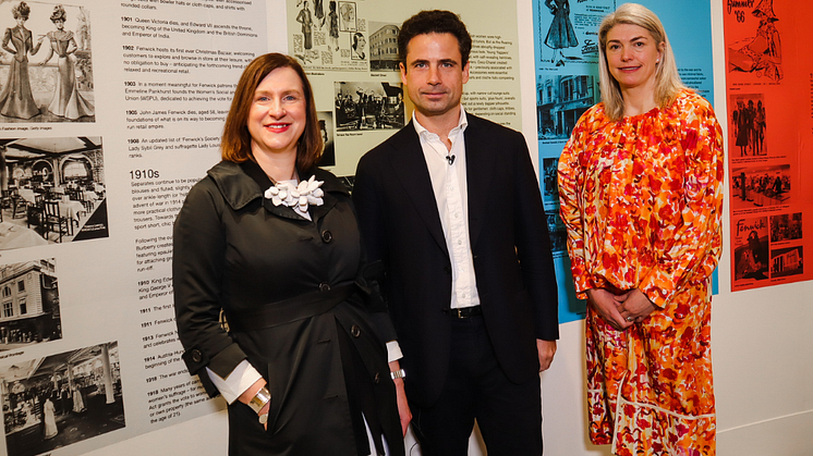 Emma Jane Goldsmith, Leo Fenwick and Kristen Pickering view the timeline at Exhibition 140. Image by Maddie Gunson