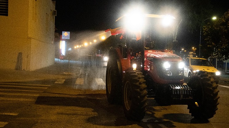A Solis 90 CV tractor disinfects the streets of Indaiatuba, Brazil.