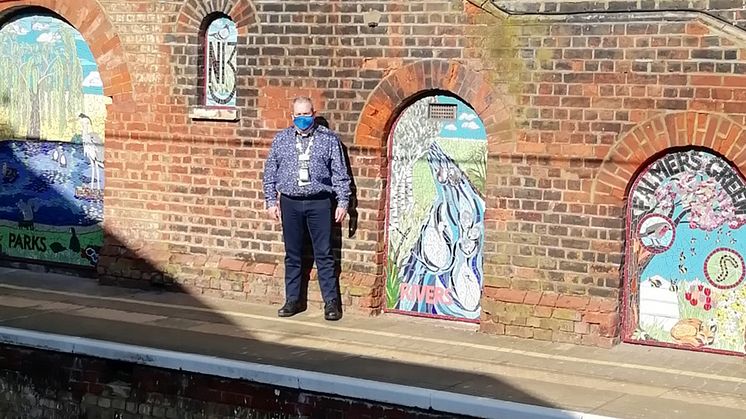 Celebrating the ‘Green’ in Palmers Green: station manager Duncan Primrose with the station's locally-inspired murals
