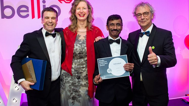 Satish 'Scotty' Kakkad collecting his 'Employee of the Year' award