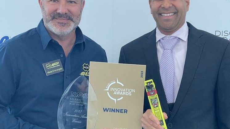ACR Electronics - ACR's Mikele D'Arcangelo and Shawn Pariaug with the 2023 Miami Innovation Award for the ResQLink AIS PLB