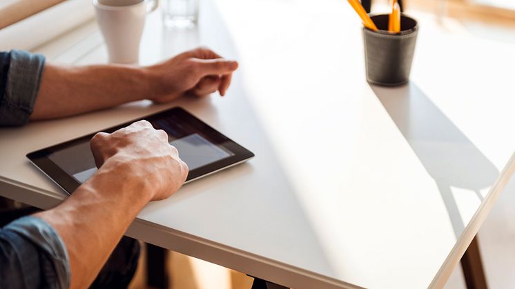 playing with tablet in a table