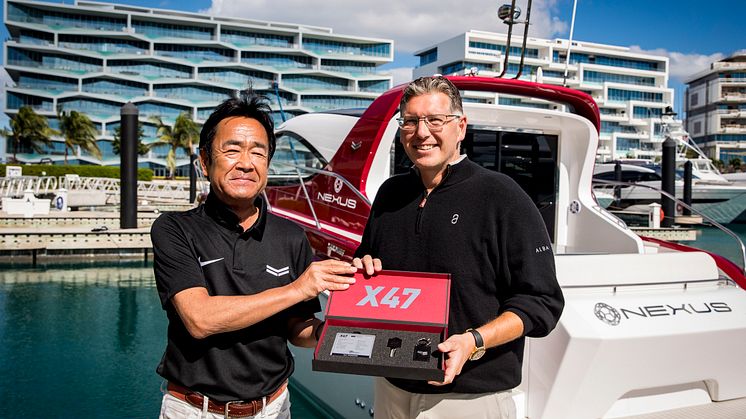 Yanmar’s Ken Araki and Christopher Anand of NEXUS with the X47 Express Cruiser