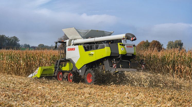 First corn picker with integrated stubble cracker