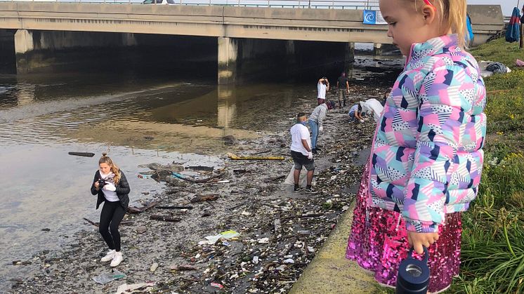 Black River_small kid looks at pollution.jpg