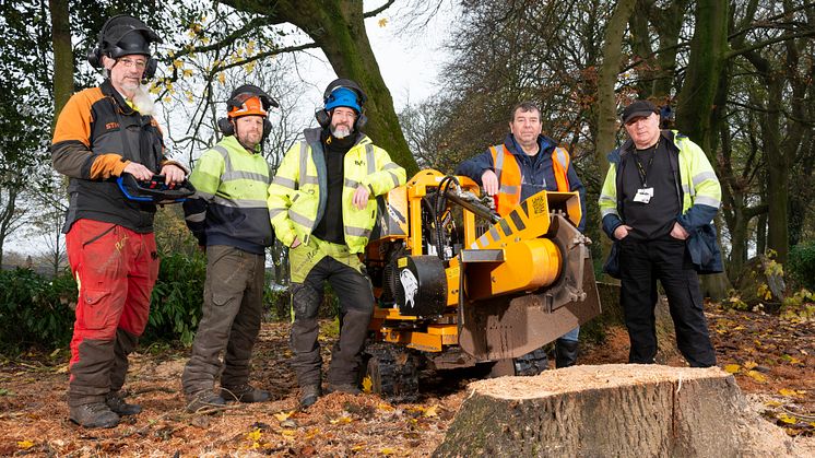 Cllr Alan Quinn (second from right) with the grounds maintenance team and the new machinery for tree stump removal.