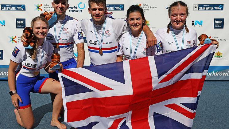 Ellen Butrick (far right) with her teammates winning gold at the World Championships. Photo credit: British Rowing/Naomi Baker
