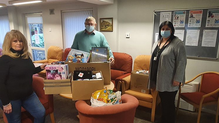 Colin Harrison of Trinity Green food bank collects the donations with staff members Claire Hill and Christine Whittaker.