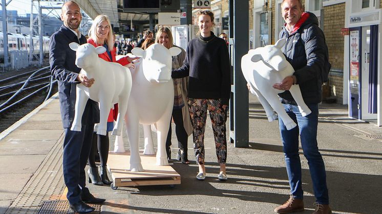 Thameslink and Great Northern Managing Director Tom Moran, GTR's Head of Marketing Emma Wiles,  Ellie Edge from Wild in Art, artist Emily Pettitte and Peter Marron from Wild in Art accompany three cows on a train trip. MORE IMAGES AVAILABLE BELOW.
