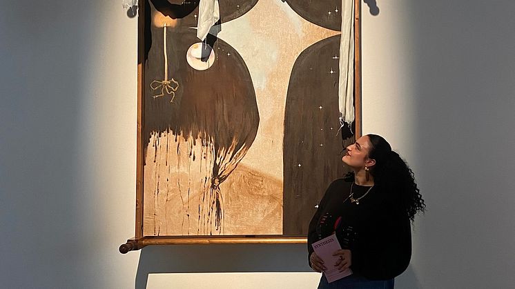 Bec Nicholson pictured with some of her work.jpg