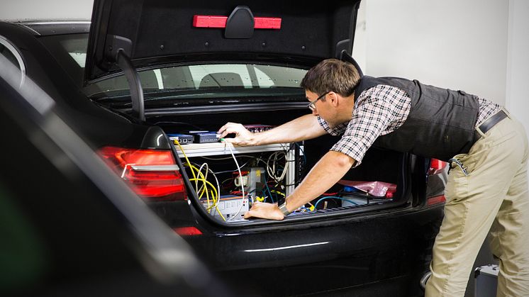 BMW engineer, André Mueller, tests autonomous driving technology in a BMW autonomous test car