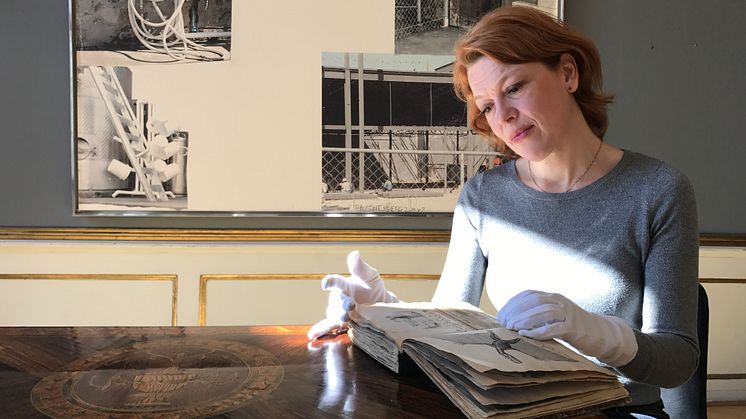 Book specialist Lærke Bøgh with H.C. Andersen's picture book.