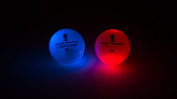 Lysande golfbollar, blå och röd