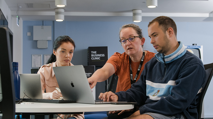 Students collaborating in the Business Clinic
