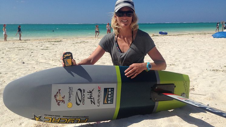 Top female kite racer Gina Hewson with her Ocean Signal rescueME PLB1