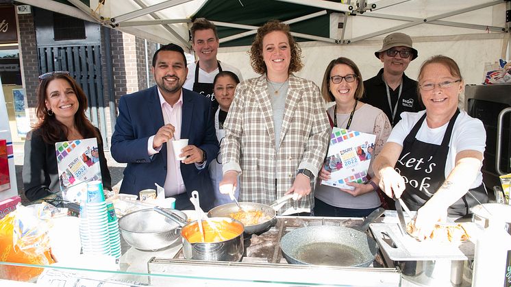 The Bury Market team show you how to cook well for less, with (front, centre) Cllrs Tamoor Tariq and Charlotte Morris.
