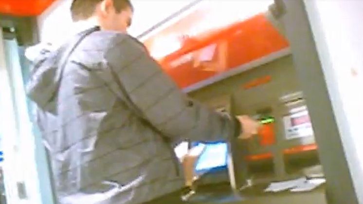 05 Still from covert footage of a cash withdrawal being made