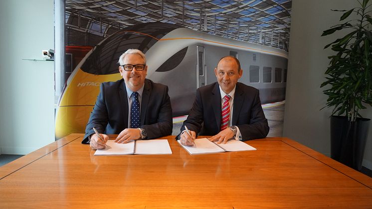From left to right: Jamie Foster (Hitachi) and Paul Bright (Lordgate) sign the contract