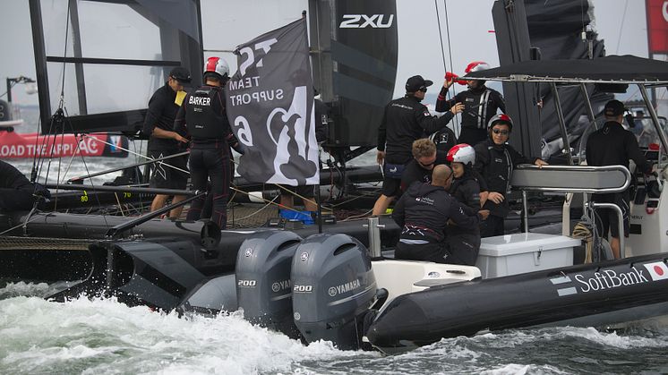 Support boats draw up to the yachts between races to provide supplies.