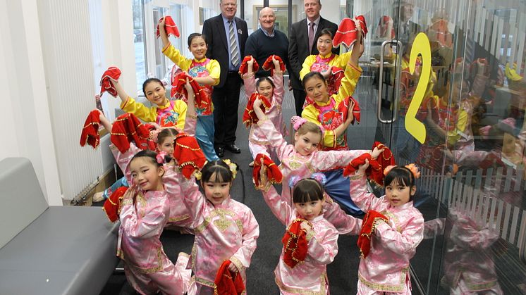 Local families Celebrate Chinese New Year in North Glasgow. ng homes Chairperson John Fury and CEO Robert Tamburrini are joined by Bob Doris MSP and dancers from Glasgow Oriental Dancing Association. 