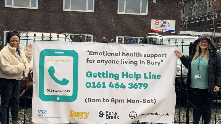 With the Getting HelpLine banner are (left) Dionne Treasure, EHWB (Early Intervention) Worker and Gemma Philburn, EHWB manager.