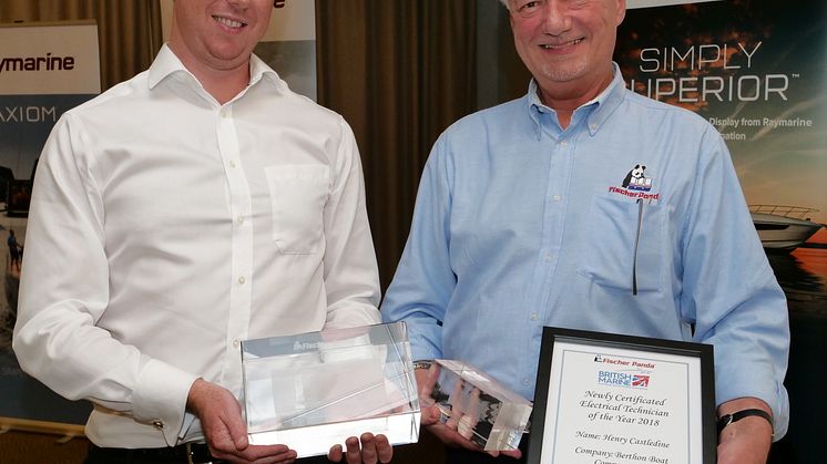 Hi-res image - Fischer Panda UK - David Melville from Fischer Panda UK presents the Fischer Panda award for the Newly Certificated Electrical Technician of the Year to Henry Castledine of Berthon Boat Co