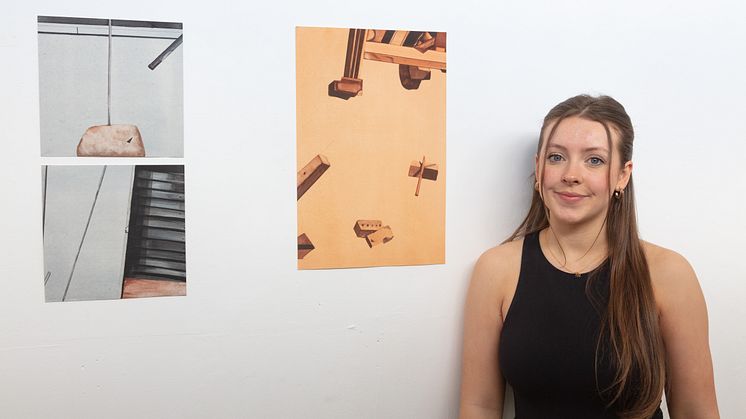 Freelands painting prize winner, Holly Smith, is pictured with some of her work.