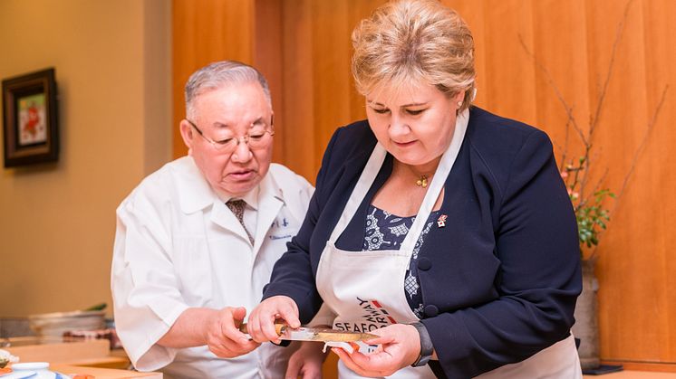 Norwegian Prime Minister Erna Solberg learns the art of sushi making from chef Tsutomu Shimamiya