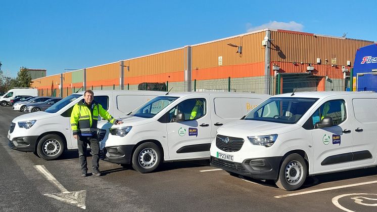 Cllr Alan Quinn with the new electric vans.