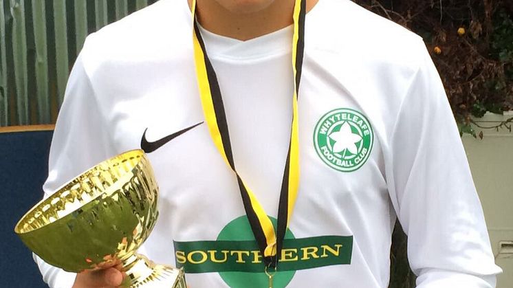 Southern-sponsored strip: Whyteleafe FC Under 16s right back "#AskEddie" Smith with the side's new kit and pre-season tournament trophy