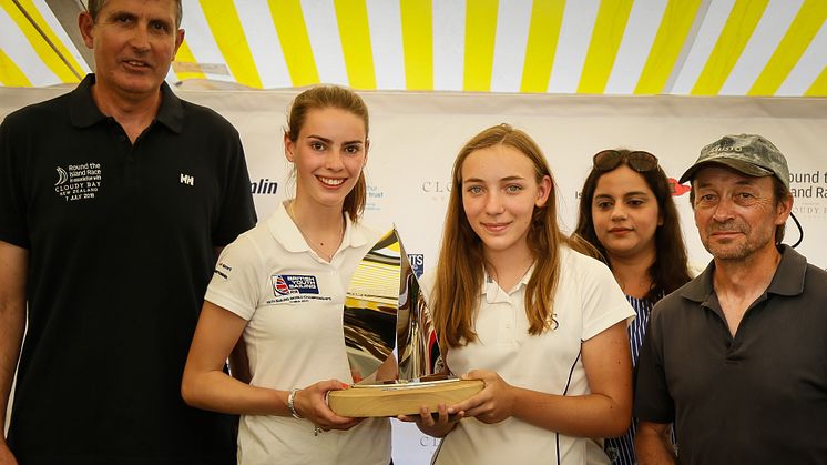 Hattie Rogers (left) and Paige Flide (right) from Hampshire Collegiate School receiving the Raymarine Young Sailor Trophy after this year's Round the Island Race 