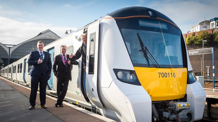 Carl Edwards, Station Manager at Brighton and Paul Bradley (Driver Manager) give a thumbs up with train driver Alan Stacey at Brighton Station before the new 12-carriage Thameslink Class 700 departs at Brighton this morning (18 September)