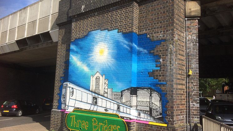 The eye-catching mural on a railway bridge outside Three Bridges station