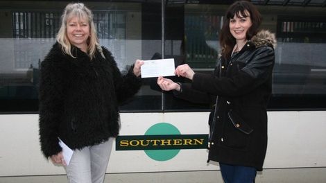 Embrace's Rebecca Whippy receives the cheque form Southern's Su Rogers