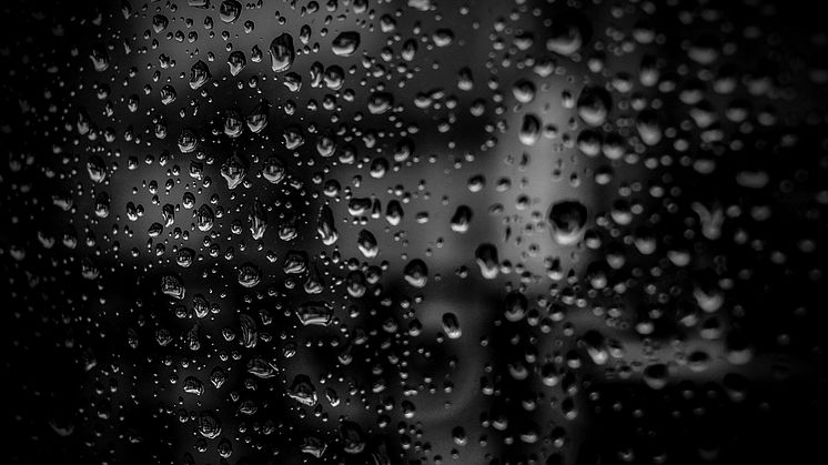 Liquid droplets on a dark surface. Credit pexels.com