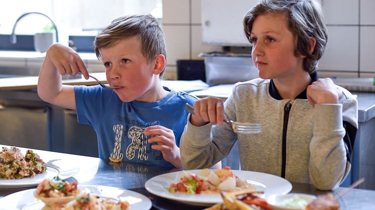 Children enjoying seafood