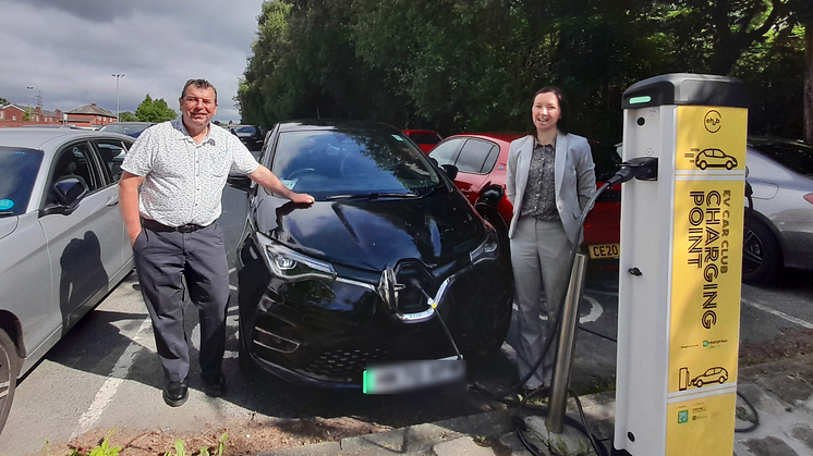 Cllr Alan Quinn and Candice Turner from Enterprise Car Club with the electric hire cars at Fairfax Road, Prestwich.
