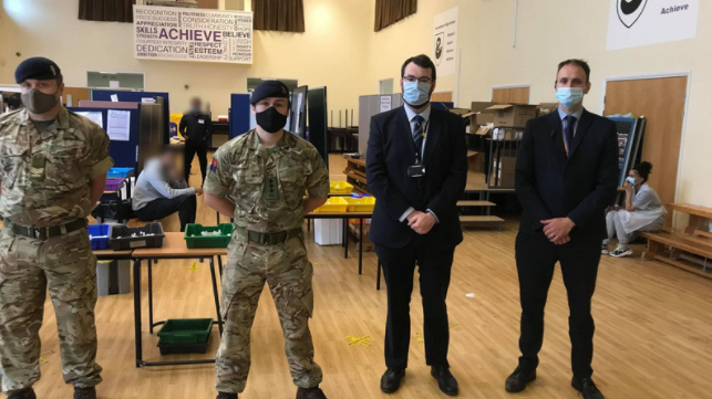 In action at Parrenthorn – soldiers from the 5th Regimental Royal Artillery, with council leader Eamonn O’Brien and deputy head teacher Allen Hall.