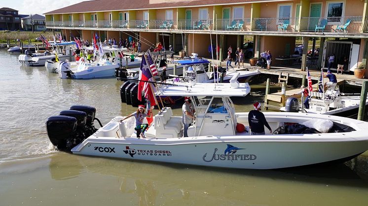 The Triple Cox-powered Invincible centre console powerboat, Justified, delivers Christmas Toys to underprivileged children in the Port O'Connor area of Texas