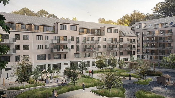 Vy över bostadshus och gården - gemensam för boende och förskola