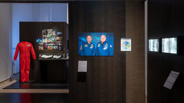 Material from Biosphere 2: Boiler suit, photos, log book, medal, 1991-94. NASA, The NASA Twin Study, 2015-16. Footage from fruit fly experiment, 2020