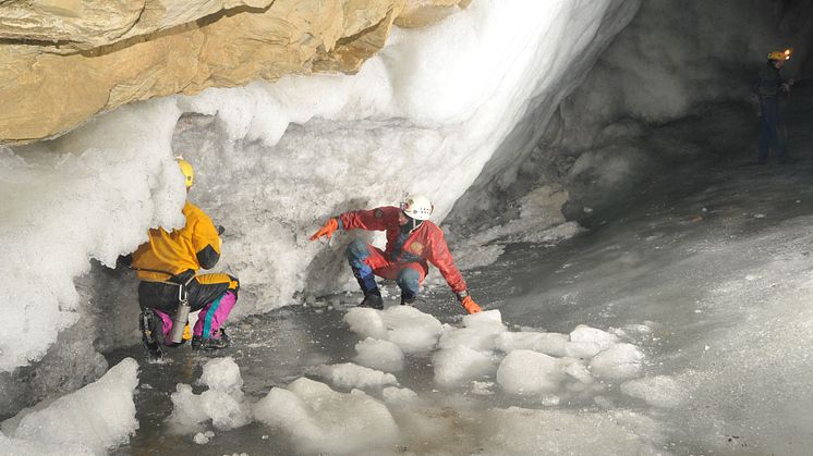 Dr Sebastian Breitenbach exploring possible passages in an ice-filled cave in Siberia