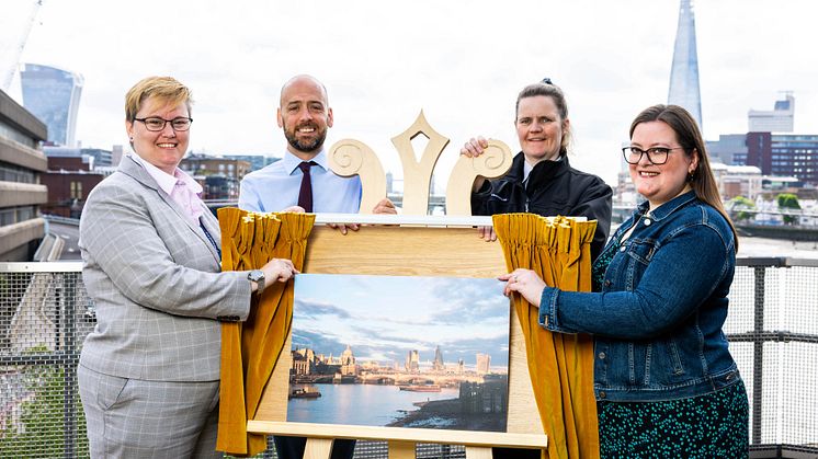 Stunning view: (From left) Station Manager Vicky O'Reilly, Managing Director of Thameslink Tom Moran and Station Assistant Donna Redding with Barbara Hough as she unveils her photograph of London Blackfriars train station (more to download below)