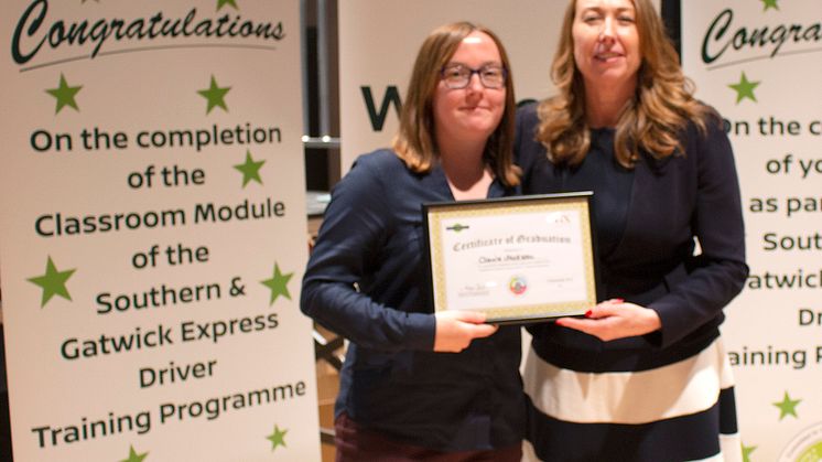 Brighton trainee driver Claire Jackson of Bexhill-on-Sea receives a certificate for completing her classroom training from Southern and Gatwick Express MD Angie Doll