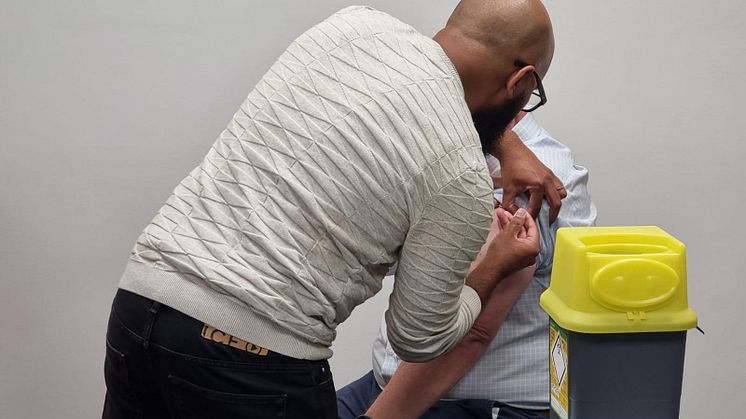 A team member at Fred. Olsen Cruise Lines receives his influenza vaccine