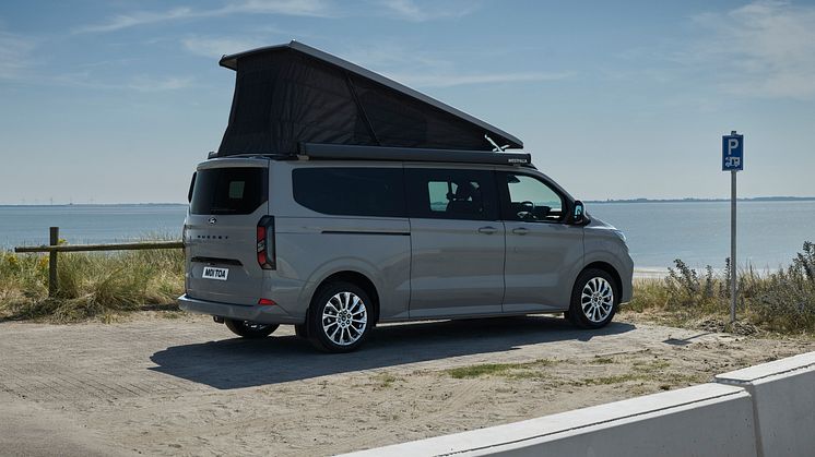 2024FordTransitNuggetLWBTitanium_3.2_3-4_rear.jpg