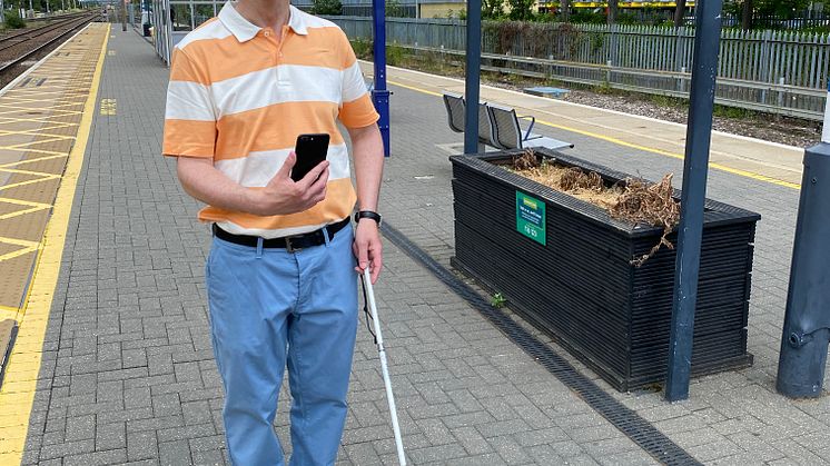 Paul Day, Bedfordshire Sight Loss Council volunteer tests out the Aira app at Stevenage station