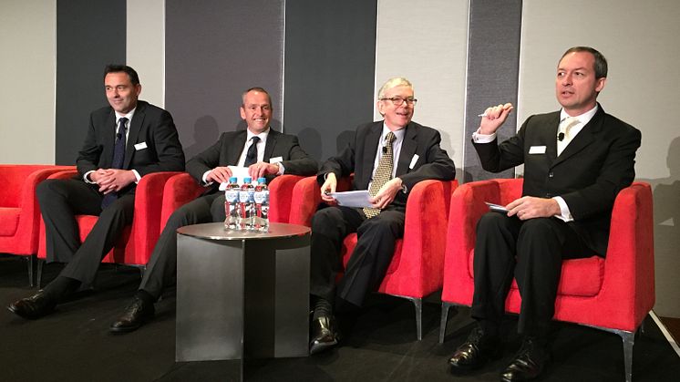 Mark Laudi moderating panel in Sydney