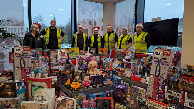 ng homes and Beam Suntory staff members  with some of the donations