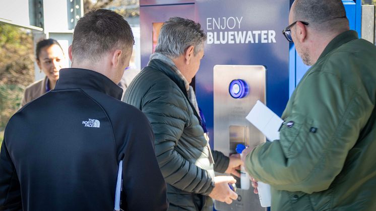 Rush to fill sustainable water bottles with Bluewater at 21st century EV recharging hub where single use plastic bottles of water are made a thing of the past
